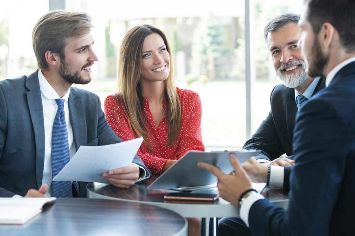 People reviewing documents at a business meeting